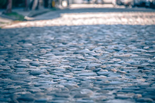 Historic old river rock stone paveres on old street — Stock Photo, Image