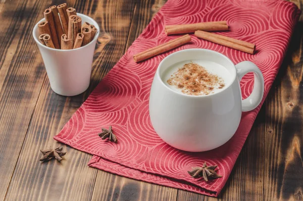 Eggnog. Traditional christmas cocktail in a white mug with cinna — Stock Photo, Image