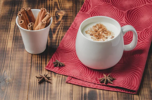 Eggnog. Traditional christmas cocktail in a white mug with cinna — Stock Photo, Image