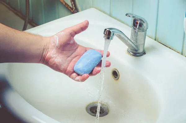 Man washing his Hands to prevent virus infection and clean dirty hands. /Man washes hands with soap