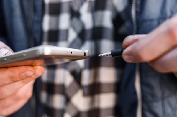 Man Inserts Plug Headphone Jack — Stock Photo, Image