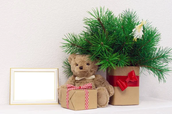 Photo frame, christmas gifts on wooden table. — Stock Photo, Image