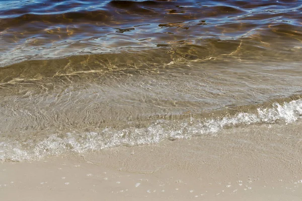 Nærbillede af sand og flodbølge - Stock-foto