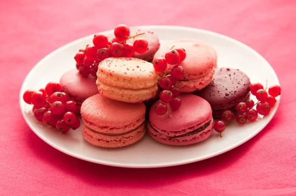 Red fruit flavored macarons with the berries