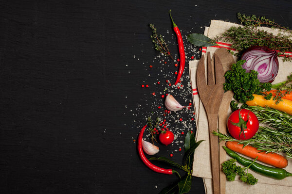 Fresh ingredients for healthy cooking on black stone slate board, top view, banner. Diet or vegetarian food concept