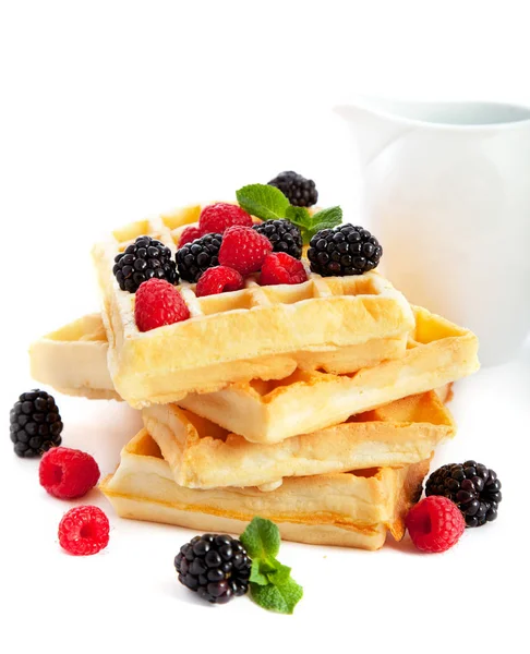 Pile of waffles with fresh berries