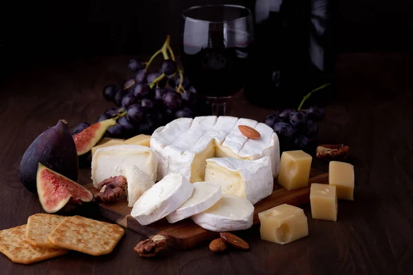 Variety Different Cheese Wine Fruits Nuts Camembert Goat Cheese Gauda — Stock Photo, Image