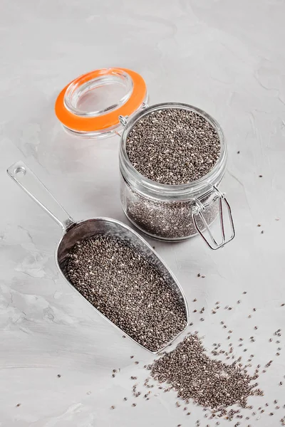 Chia seeds rich in healthy fats, plant-based protein, calcium and various minerals. Healthy antioxidants food concept reducing risk of Heart Disease. Weight loss balanced diet