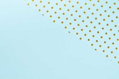 Mavi kağıt kağıtlar ve altın puantiyelerle yapılan soyut arkaplan