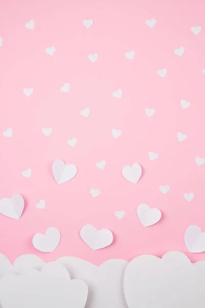 Paper hearts and clouds over pink background. Love, Sainte Valentine, mother's day, birthday greeting cards, invitation, celebration concept — Stock Photo, Image