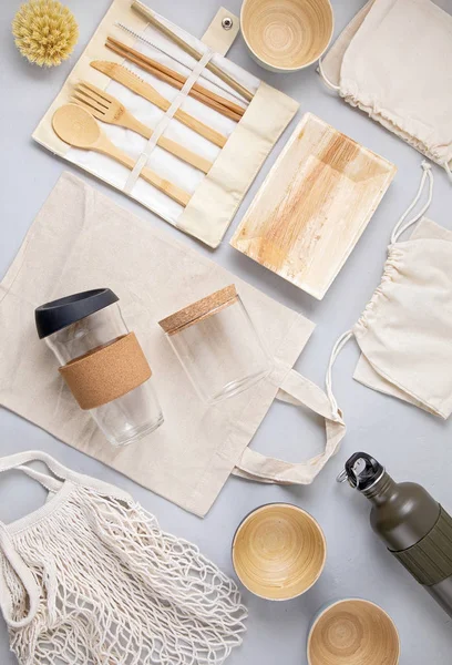 Zero waste kit. Set of eco friendly bamboo cutlery, mesh cotton bag, reusable coffee tumbler and water bottle. Sustainable, ethical, plastic free idea — Stock Photo, Image