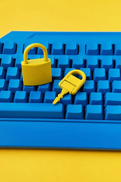 Cyber data and information security idea. Yellow padlock and key and blue keyboard. Computer, information safety, confidentiality concept — 스톡 사진