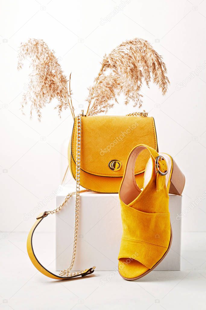 Yellow female fashion accessories, shoes, sunglasses and handbag. Beauty, shopping, urban outfit and fashion concept