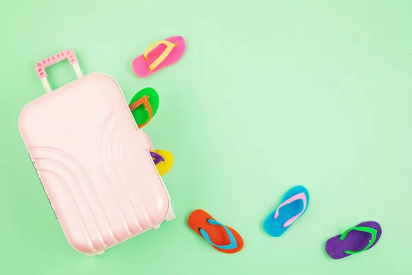 Travel baggage suitcase with summer vacations accessories. Summer holidays, travel to tropical countries, seaside, summertime style concept. Top view, flat lay