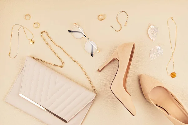 Flat lay with woman fashion accessories in beige colors. Fashion blog, summer style, shopping and trends concept