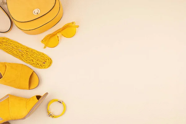 Flat lay with woman fashion accessories in yellow and blue colors. Fashion blog, summer style, shopping and trends concept