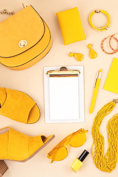 Flat lay with woman fashion accessories in yellow and blue colors. Fashion blog, summer style, shopping and trends concept