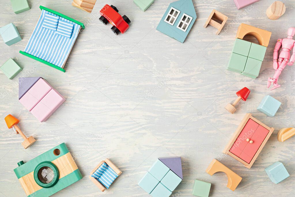 Flat lay with wooden  blocks in pastel colors. Eco friendly, zero waste, plastic free, educational, gender neutral toys for children. Copy space, top view