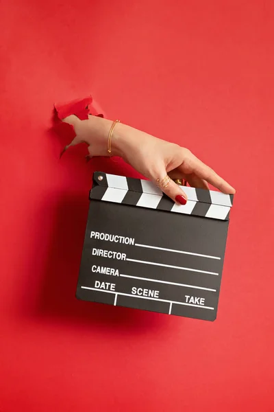 Woman Hand Holding Movie Clapper Hole Red Paper Background Making — Stock Photo, Image