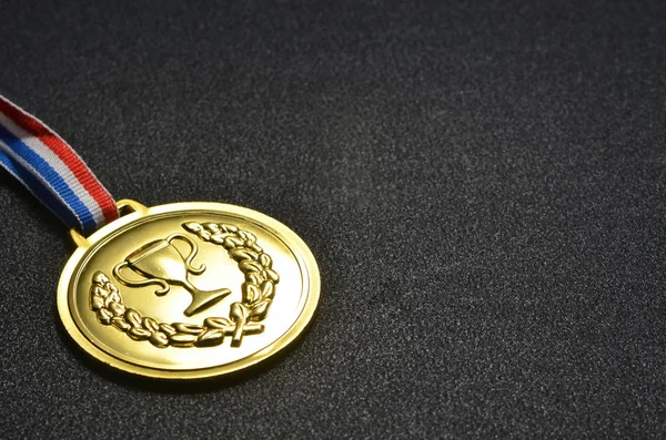 Gold medal with black background Stock Picture