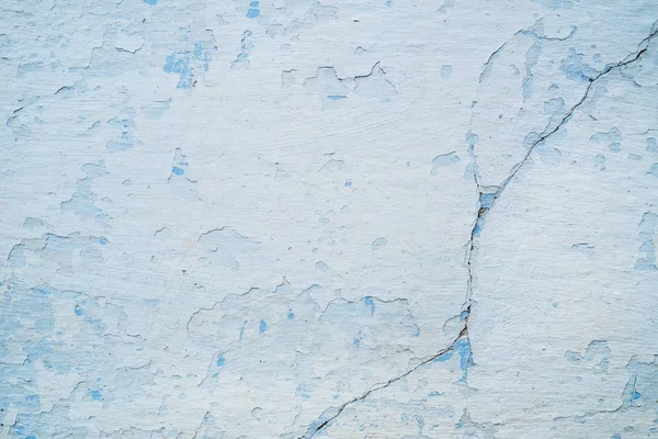 White blue wall with scratches and cracks — Stock Photo, Image