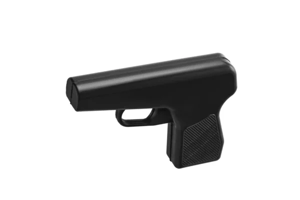 Pistolet factice en caoutchouc noir isolé sur fond blanc. Mauvaise trame — Photo
