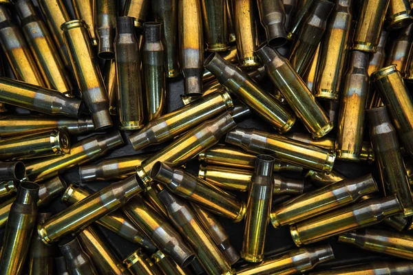 Background from empty cartridges for rifles and carbines. Shiny — 스톡 사진
