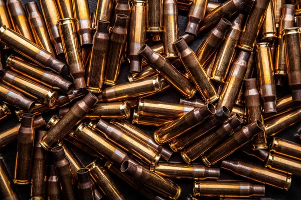 Background from empty cartridges for rifles and carbines. Shiny — 스톡 사진