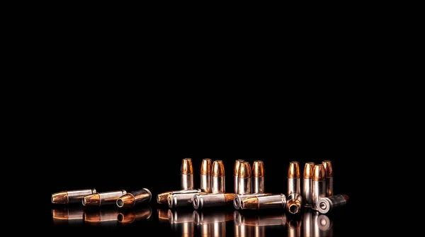 Bullet isolated on black background with reflexion. Rifle bullet — Stock Photo, Image