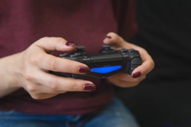 Ukraine, Odessa  July 2, 2019: A girl plays a video game on a p