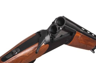 Classic vertical double-barreled hunting rifle isolate on a white background. Smoothbore weapon with a wooden butt for hunting, sports and self-defense.