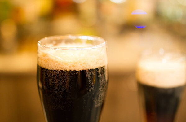 Glasses of dark beer