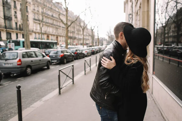 Romantic pair is kissing and hugging on the street — Stock Photo, Image