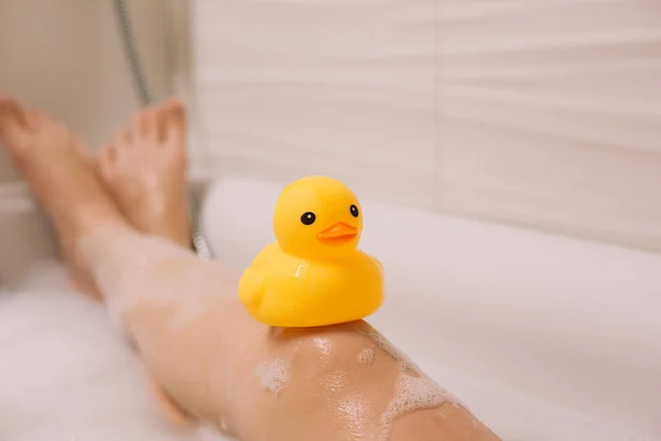 Girl Holding Her Legs Yellow Rubber Duck Bath Bubble Foam — Stock Photo, Image