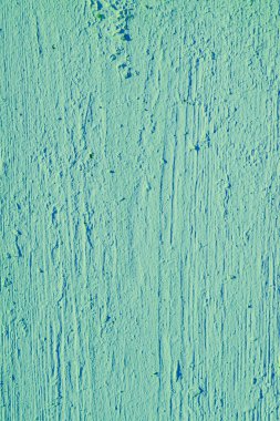 Old cracked green paint on a wooden board. Creative vintage back