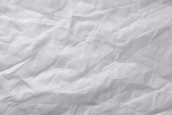 Texture of crumpled white fabric with a blue tint. White flag, r
