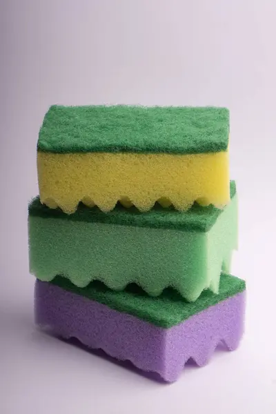 Three multi-colored foam sponges for washing dishes on a white b — Stock Photo, Image