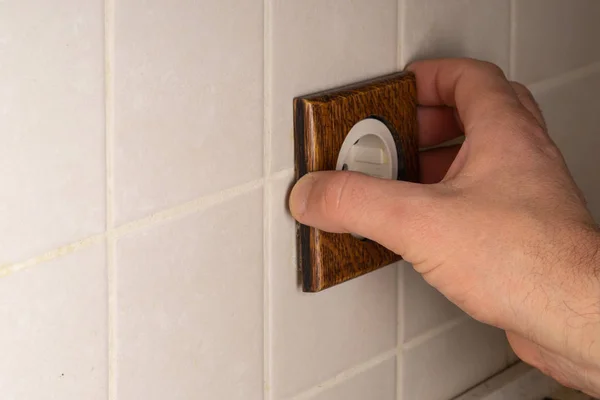 Socket Installation. A master electrician installs an electrical — Stock Photo, Image