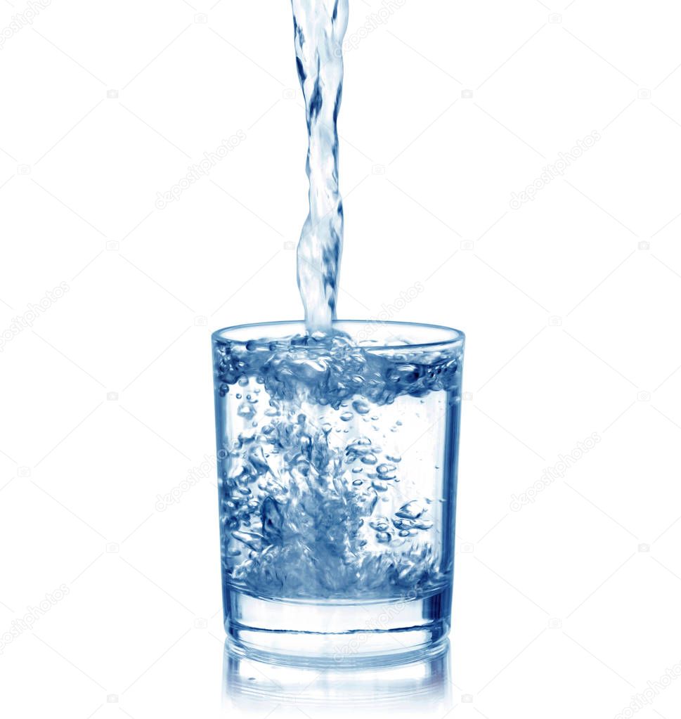 Water pouring into the glass, isolated on white