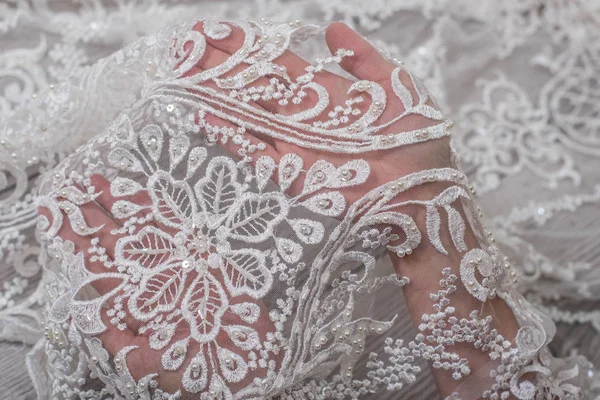 Texture, background, pattern. white lace fabric. This wonderful lace is perfect for your design, wedding jewelry, This lace has a beautiful rich texture and feels to it. — Stock Photo, Image