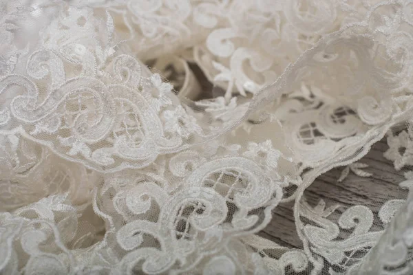 Texture, background, pattern. white lace fabric. This wonderful lace is perfect for your design, wedding jewelry, This lace has a beautiful rich texture and feels to it. — Stock Photo, Image