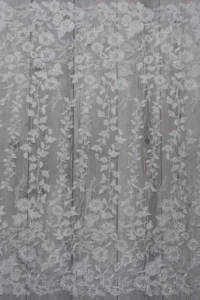 The texture of lace on wooden background — Stock Photo, Image