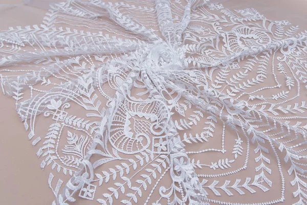 Texture lace fabric. lace on white background studio. thin fabric made of yarn or thread. a background image of ivory-colored lace cloth. White lace on beige background. — Stock Photo, Image