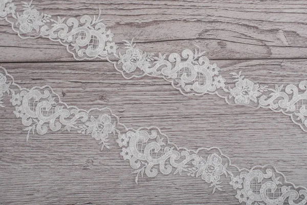 Texture, background, pattern. white lace fabric. This wonderful lace is perfect for your design, wedding jewelry, This lace has a beautiful rich texture and feels to it. Stock Picture