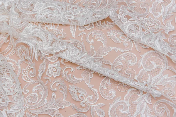 Texture lace fabric. lace on white background studio. thin fabric made of yarn or thread. a background image of ivory-colored lace cloth. White lace on beige background. — Stock Photo, Image