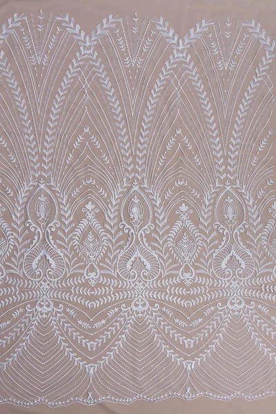 Texture lace fabric. lace on white background studio. thin fabric made of yarn or thread. a background image of ivory-colored lace cloth. White lace on beige background. — Stock Photo, Image