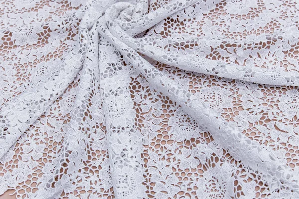 Texture lace fabric. lace on white background studio. thin fabric made of yarn or thread. a background image of ivory-colored lace cloth. White lace on beige background. — Stock Photo, Image