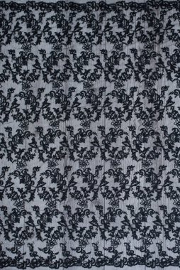 Ahşap arka planda siyah dantelin dokusu