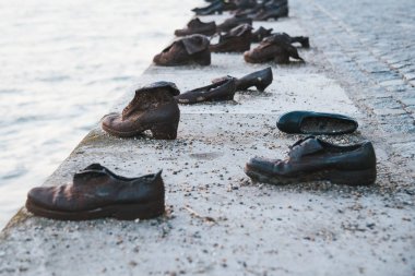 Budapest/Hungary - June 29, 2019 : Shoes on the Danube Bank near Parlament