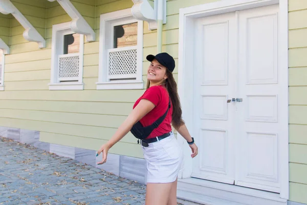 stock image Portrait of young attractive cute teenage girl wearing cap looking at camera smiling with urban lifestyle concept. Crazy funny teenager.